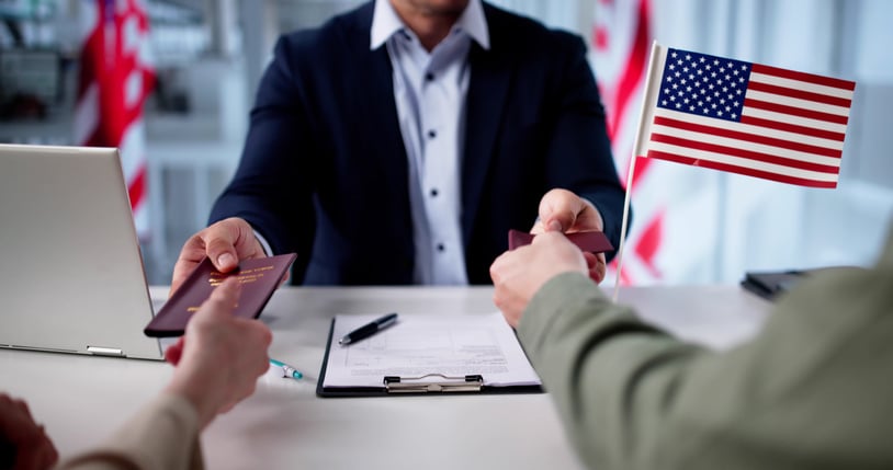 Attorney reviewing immigration paperwork and criminal case documents