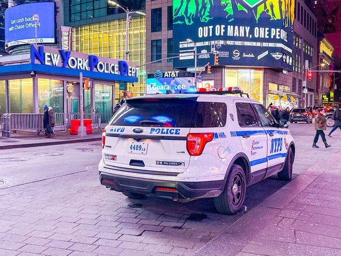 Police conducting a nighttime traffic stop related to suspected impaired driving.
