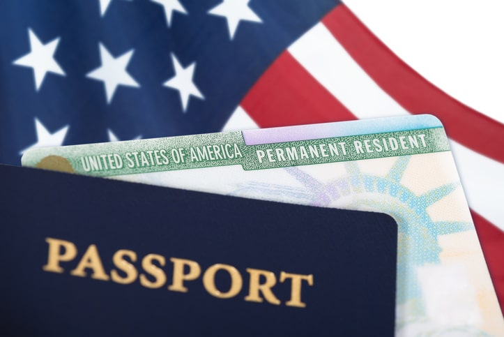 Passport and permanent resident card prepared for international travel.