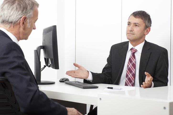 Non-citizen reviewing a criminal plea offer with an immigration attorney