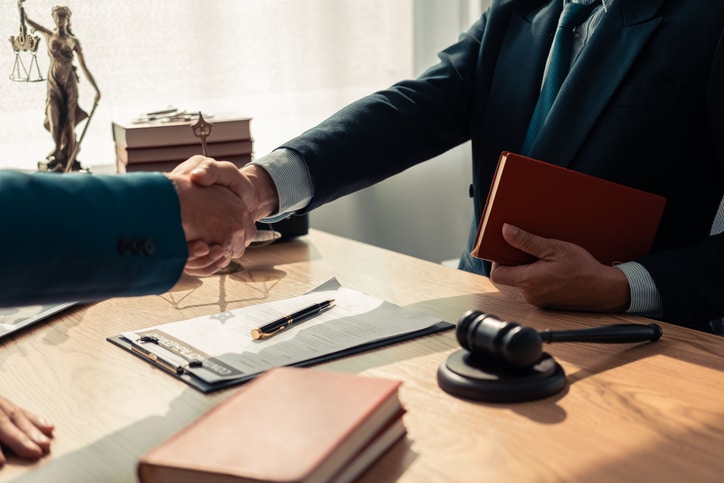 Attorney discussing a criminal case confidentially with a client