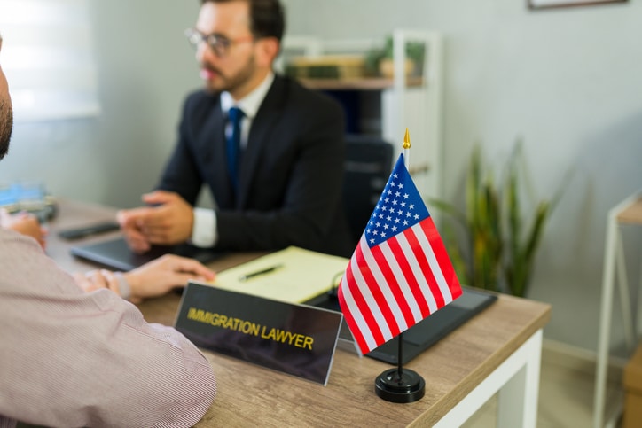 Immigration attorney reviewing a Notice to Appear with a client