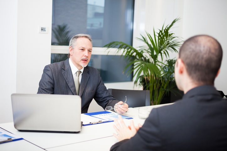 Immigration lawyer reviewing documents with client before an ICE check-in
