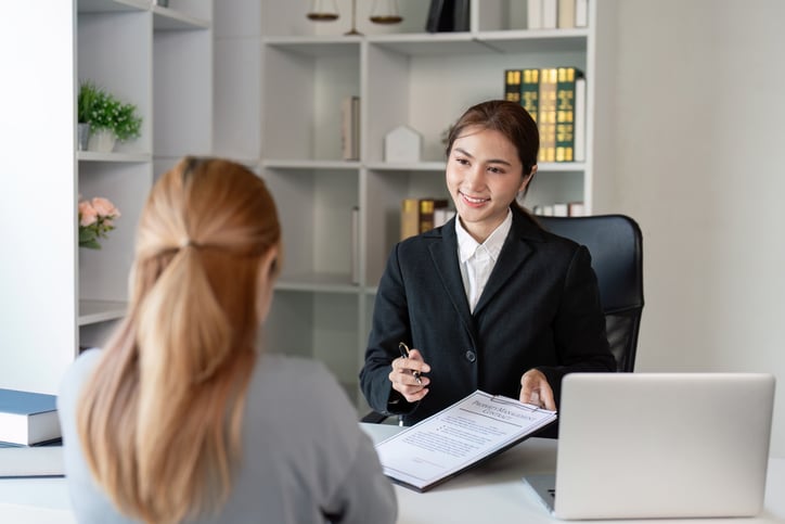 Attorney Reviewing an Immigration Detention Case With a Client